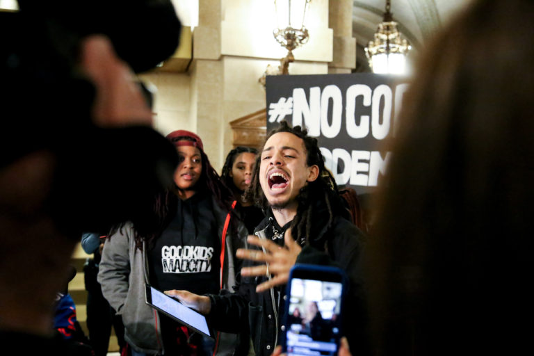 A young activist speaking during a die-in at City Hall for a #NoCopAcademy protest