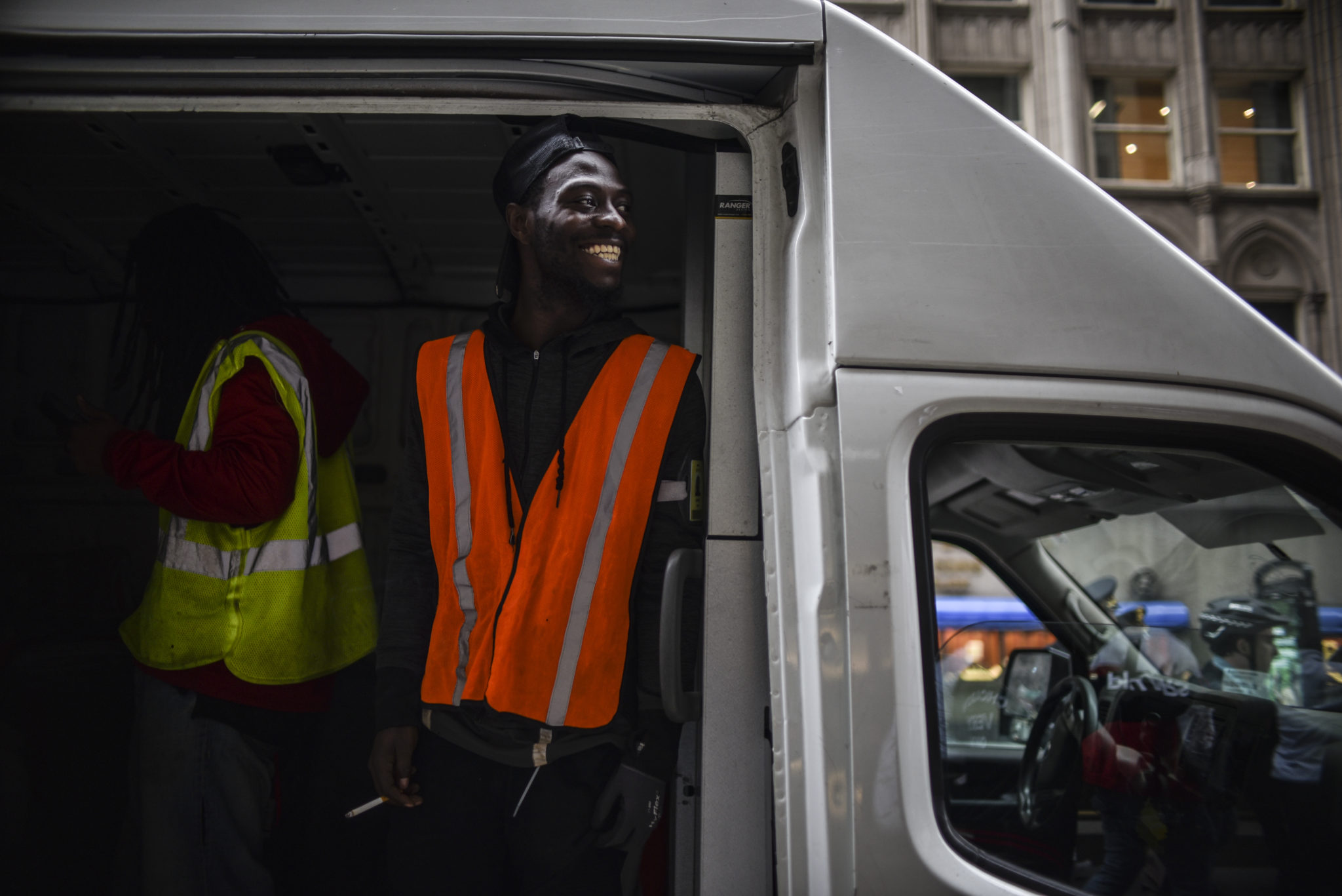 City workers smiling in support of the marchers.