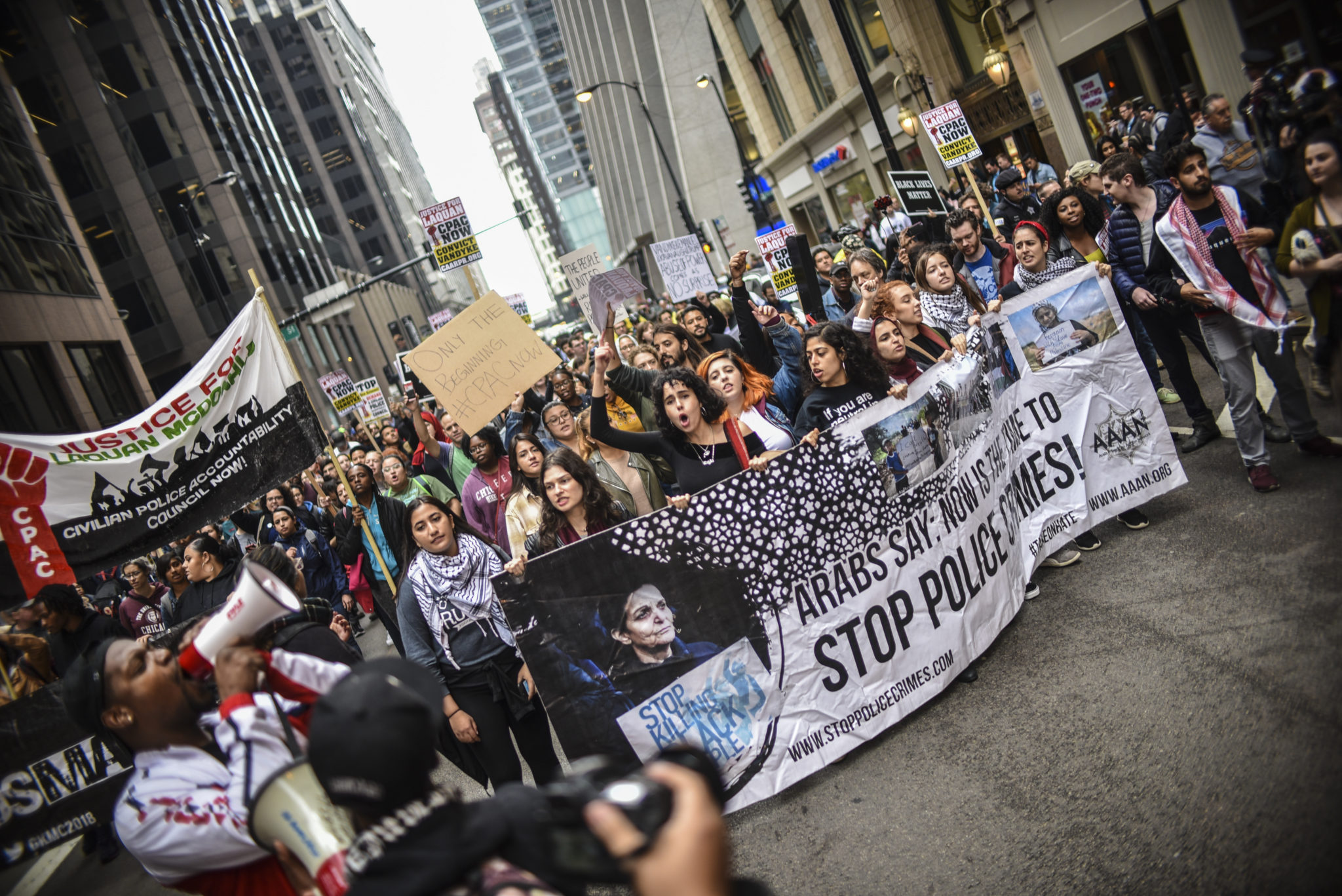 Black and Brown folks marching together after the verdict