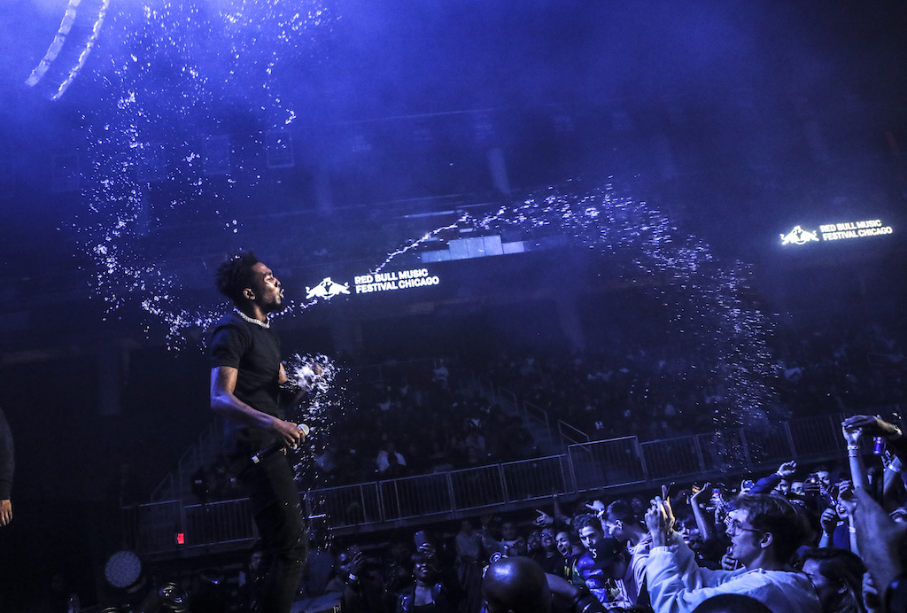 G.O.O.D. rapper Desiigner spraying the crowd during his set.