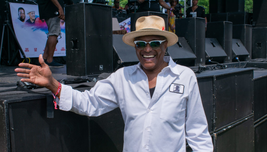 Chicago music legend George Daniels catching Motown diva Thelma Houston's set