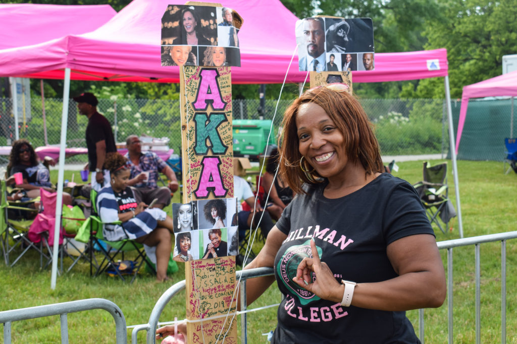 Joi Basley posing in front of her tent at the Chosen Few Picnic