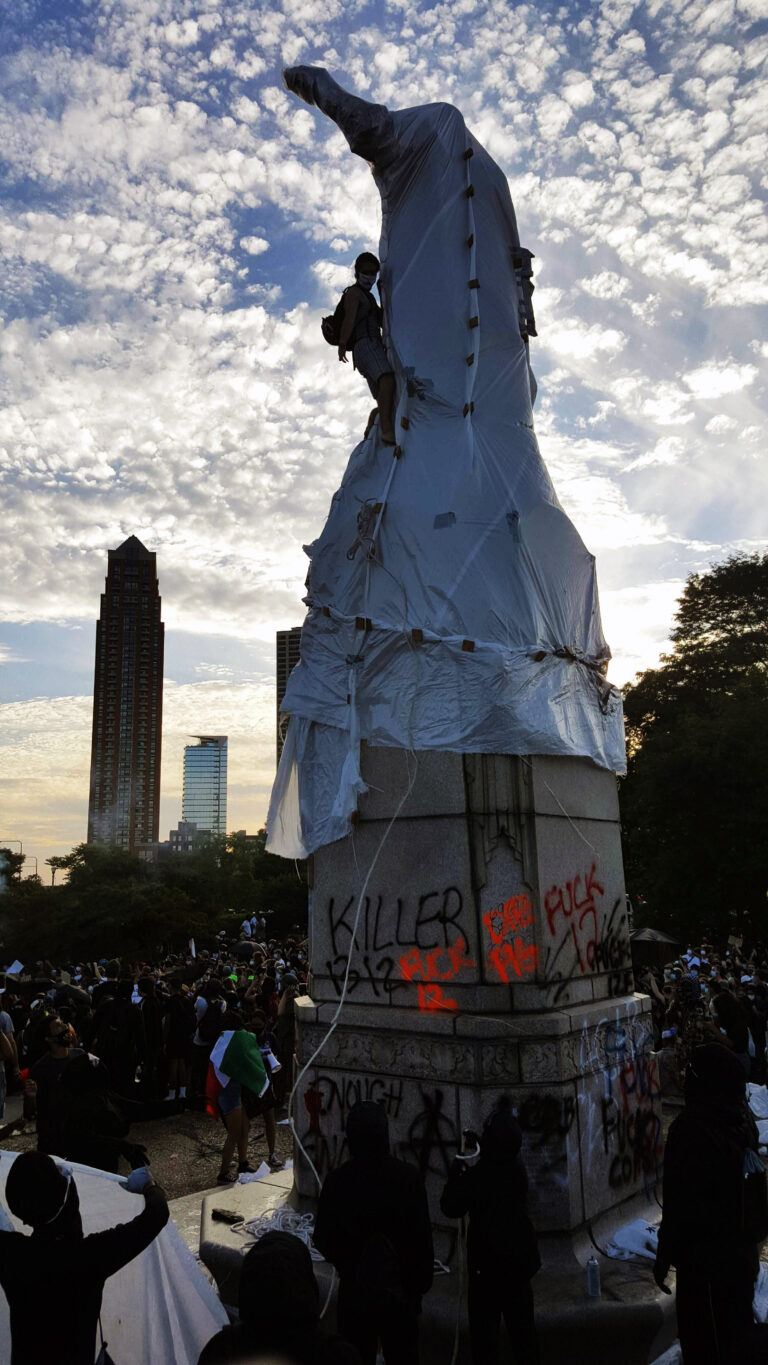 The Christopher Columbus statue in Grant park during a Decolonize Zhigaagoong protest on Friday, July 17 | Photo by Anthony Bryant/The TRiiBE