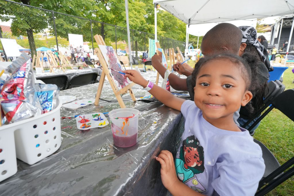 Children making art at the painting area at Englewood Music Fest. Photo provided by Tito Garcia.