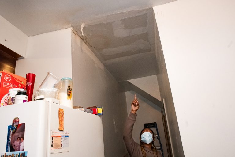 On November 7, Shirley Anderson, a resident of North Lawndale, shows the flood damage from July 2023 in her kitchen. Photo by Ash Lane for The TRiiBE®